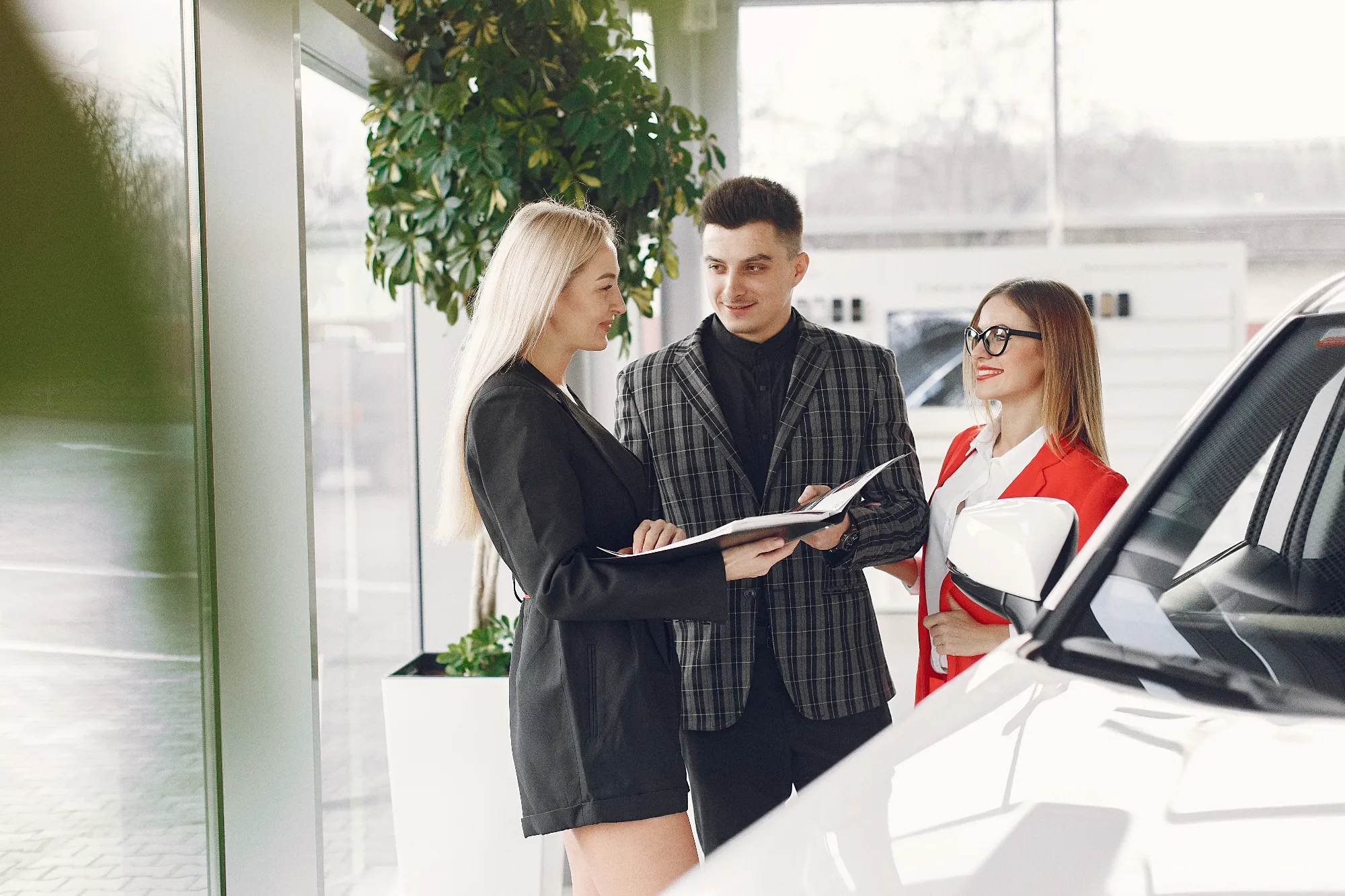 Credit approval advisors assisting customers with car financing at Value Car Deals serving the Lower Mainland region of Canada